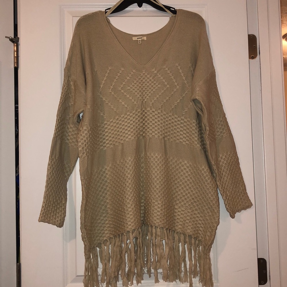 Fringed oversized sweater.